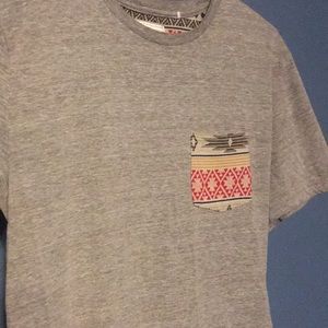 Grey on the Byas shirt